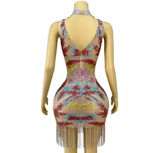 Detailed back view of sexy bodycon mini dress featuring colorful rhinestones and fringe