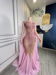 Pink deep V mermaid gown with heavy rhinestones for stage performance and drag queen events.