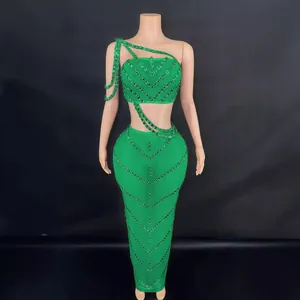 Elegant emerald green rhinestone crop top and matching long bodycon maxi skirt set for party
