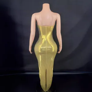 Elegant gold metallic backless long bodycon evening dress seen from the back view