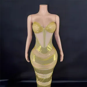 Elegant gold rhinestone bodycon evening gown with sheer panels for formal party occasions.