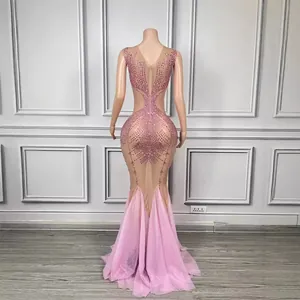 Sparkling pink mermaid evening gown with heavy rhinestones and sheer mesh back