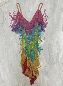 Detailed view of the colorful rhinestone fringes and mesh fabric on this mini dress