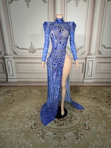 Elegant blue sequined evening gown with a high neck and side slit, shown on a mannequin.
