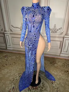 Detailed view of a sparkling blue rhinestone evening gown with a high leg slit
