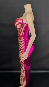 Detailed side view of a hot pink corset-style bodycon evening dress with shiny stripes