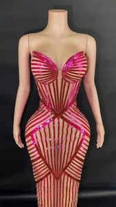 Close-up detail of fuchsia metallic striped bodycon gown featuring a corset-style bodice