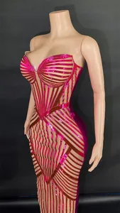 Detailed view of rose red boned tube top evening gown with metallic striped pattern