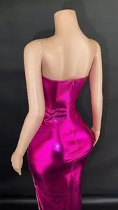 Back view of a shiny metallic magenta bodycon tube dress with corset boning details