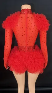 Back view of red rhinestone bodysuit with ruffled shoulders and mesh tutu skirt.