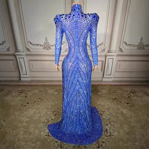 Elegant bright blue sequin long-sleeved gown with rhinestone embellishments, stunning back view