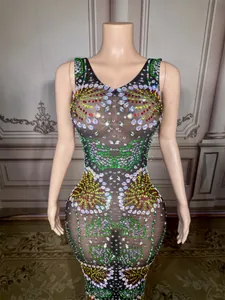 Detail view of colorful rhinestones on a sheer black slim-fit evening party dress