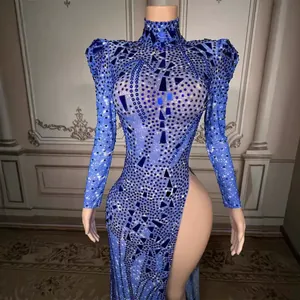 Elegant blue sequin evening dress with high neck, long sleeves, and a sexy high side slit.