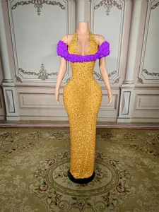 Elegant yellow rhinestone floor-length evening gown with purple floral wrap detail