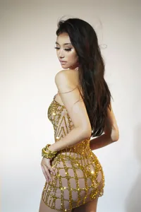 Side view detail of a sexy gold rhinestone grid mini dress for stage performances