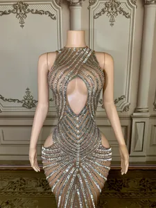Close-up of high-end sexy mesh evening gown featuring silver rhinestone strip patterns