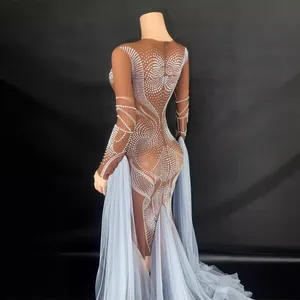 Elegant nude evening gown with rhinestones and light blue tulle train detail