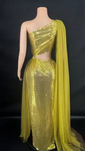 Detailed back view of gold one-shoulder sequined evening gown with cutout design