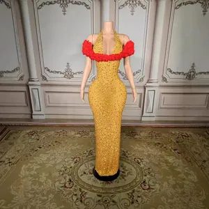 Elegant yellow sequin evening gown with red floral off-shoulder detail and deep V-neck.