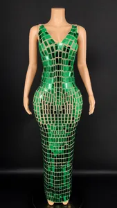 Close-up of green mirror sequined evening dress with slim fit design