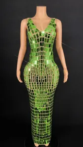 Detailed view of fluorescent green mirrored sequins on a slim party evening gown