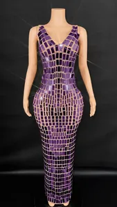 Elegant front view of a purple sequined bodycon evening dress on a mannequin stand.