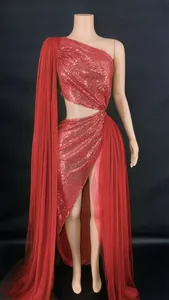 Detailed view of red sequin one-shoulder evening gown with cutout waist and high slit