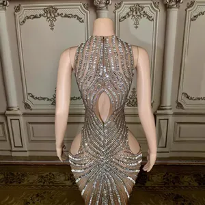 Elegant nude mesh evening gown with sparkling silver rhinestone fringe detailing