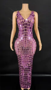 Detail view of a rose pink party dress featuring shimmering square mirror sequins