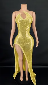Glamorous gold sequin halter neck long dress featuring a sexy high slit and cutout design