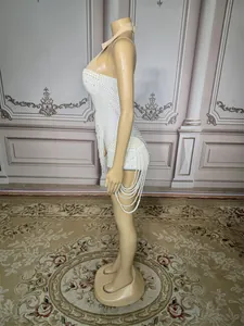 Side view of white pearl-encrusted fringe bodysuit for stage performance and clubwear