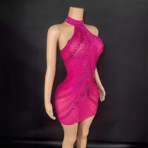Sparkling hot pink halter mini dress with intricate beadwork for performance and parties