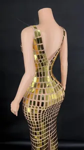 Detailed back view of a slim fit evening dress featuring gold mirror tiles for parties