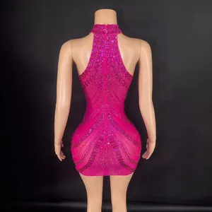 Stunning hot pink halter mini dress with intricate rhinestone patterns for gala party