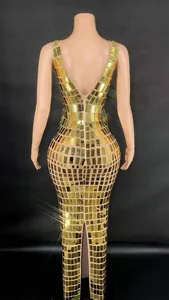 Detail view of a shimmering gold sequin evening dress with a deep V-neck and slim fit