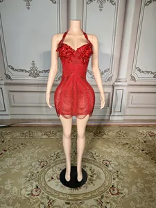 Front view of a red tassel mini dress with intricate rhinestone and bead embellishments.
