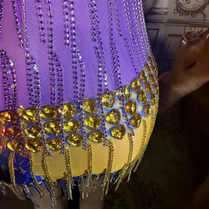 Luxurious purple mesh bodycon mini dress with sparkling rhinestone tassels and heart-shaped gems