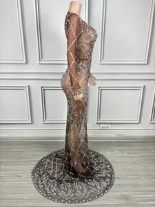 Side view detail of an elegant sheer brown mesh evening gown with sparkling rhinestones
