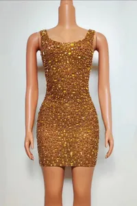 Detail view of a luxury gold rhinestone sleeveless bodycon mini dress on mannequin
