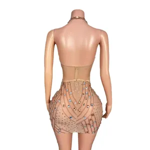 Elegante huidskleurige halter mini-jurk met fonkelende strass en mesh korset details