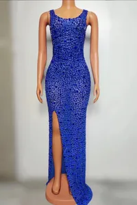 Luxurious royal blue sequined evening dress with sexy side split detail on mannequin