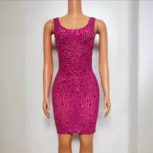 Fuchsia sleeveless mini dress with all-over rhinestone embellishments for a glamour look.