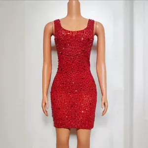 Elegant red sleeveless bodycon mini dress featuring sparkling rhinestone embellishments