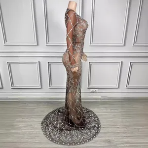 Elegant floor-length evening gown with long sleeves and shimmering rhinestone details