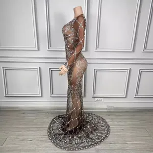 Elegant long sleeve sheer coffee-colored rhinestone floor-length evening gown on mannequin