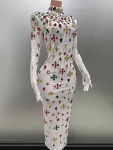 Elegant white bodycon evening gown featuring colorful rhinestones and integrated gloves.
