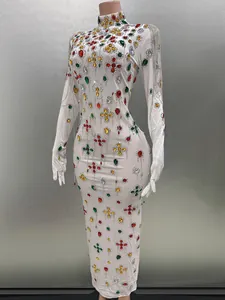 White bodycon evening dress with colorful rhinestones, silver tassels and integrated gloves
