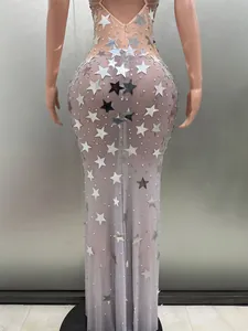 Back view of sleeveless lilac evening dress with silver star sequins and pearls.