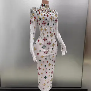 White bodycon evening gown with colorful rhinestones, fringe, and matching gloves