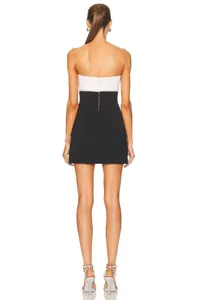 Back detail view showing the elegant cut and fit of the black and white bandage dress